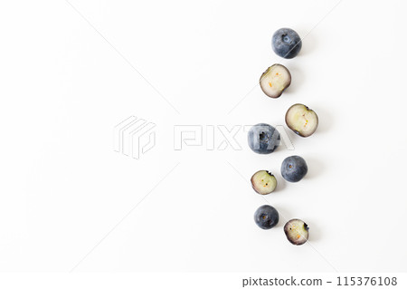 Ripe organic blueberries on white wooden table background. Selective focus. Ripe organic blueberries on white wooden table background. Selective focus. 115376108