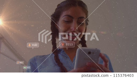 Image of social media icons with numbers over biracial woman using smartphone 115376403