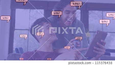 Image of lol text in speech bubbles over diverse male couple using tablet 115376438