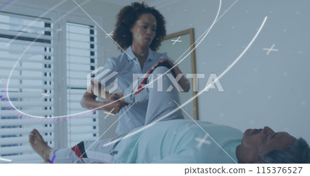 Image of scope scanning over diverse doctor and patient exercising Image of scope scanning over diverse doctor and patient exercising 115376527