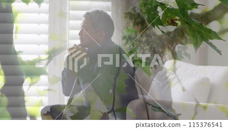 Image of leaves over senior biracial man sitting and holding walking cane Image of leaves over senior biracial man sitting and holding walking cane 115376541