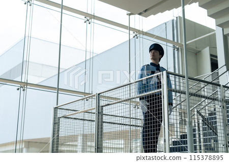 Silhouette of a security guard patrolling a building Silhouette of a security guard patrolling a building 115378895