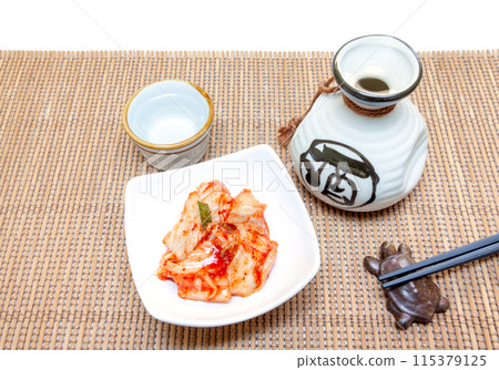 Drinking sake with spicy kimchi 115379125
