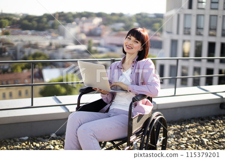 Business woman enjoys the view while working online on a roof top. 115379201