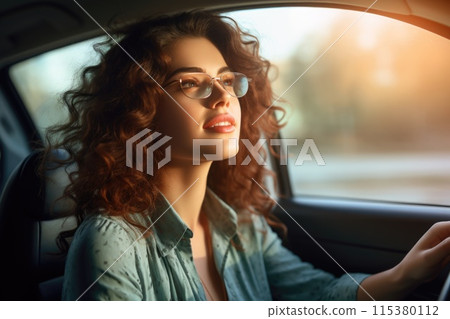 Driving elegance: handsome woman behind the wheel of car - embodying grace and confidence as a stylish woman navigates the road, merging sophistication with automotive prowess. Driving elegance: handsome woman behind the wheel of car - embodying grace and confidence as a stylish woman navigates the road, merging sophistication with automotive prowess. 115380112