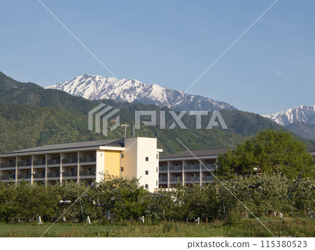 The Northern Alps mountain range sparkling with remaining snow The Northern Alps mountain range sparkling with remaining snow 115380523