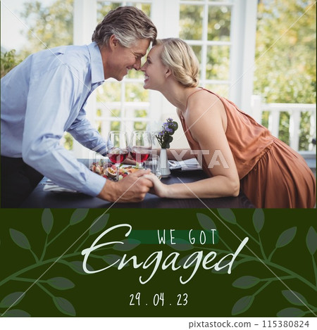 Celebrating love, a couple shares a romantic engagement moment over wine and food 115380824