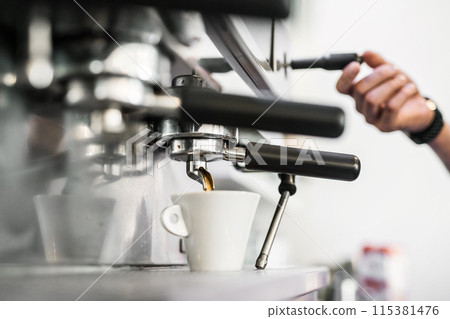 Espresso machine pouring fresh black coffee, close up. 115381476
