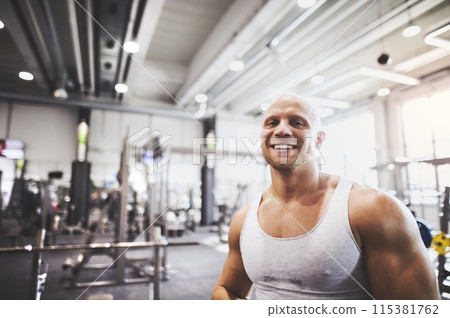 Strong man exercising in gym. Routine workout for physical and mental health. 115381762