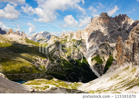 Rocky peaks of Italian Dolomites on sunny summer day Rocky peaks of Italian Dolomites on sunny summer day 115381870
