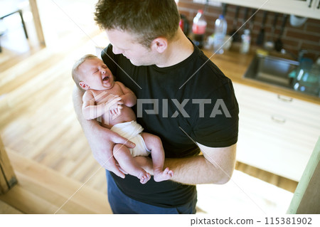 Father holding his newborn baby. Unconditional paternal love, Father's Day concept. 115381902