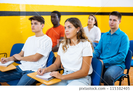 Group of people studying in school for taxi drivers 115382405