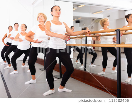 Group of women doing ballet dance moves Group of women doing ballet dance moves 115382406