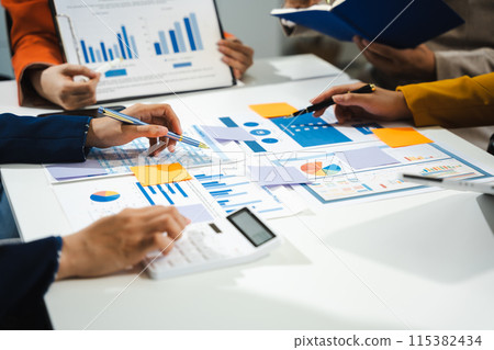 Business team calculate and analyzing graph document financial with laptop and digital tablet in office. 115382434