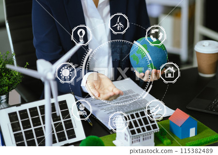 Businessman working virtual modern computer to reduce CO2 emissions carbon footprint climate change to limit global warming.Sustainable development and innovation green business concept. Businessman working virtual modern computer to reduce CO2 emissions carbon footprint climate change to limit global warming.Sustainable development and innovation green business concept. 115382489