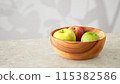 Apples and the shadow of sunlight filtering through the trees 115382586