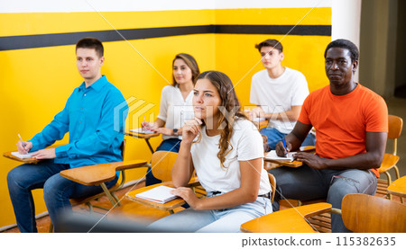Men and women studying in taxi driving school 115382635