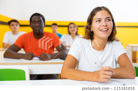 Young woman attending lecture in taxi training school Young woman attending lecture in taxi training school 115382858