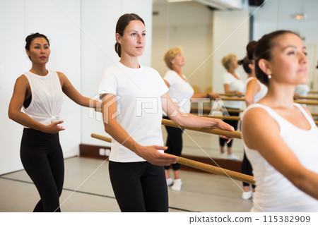 Warm-up sessions at bench, women doing ballet 115382909