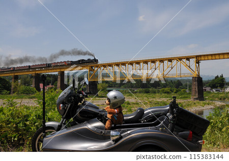Banetsu Monogatari on the Ban-Etsusai Line crossing the iron bridge with black smoke 115383144