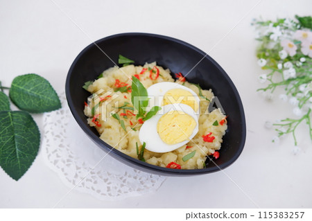mashed potatoes with eggs as a background 115383257