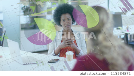 Image of financial data processing over diverse businesswomen in office Image of financial data processing over diverse businesswomen in office 115384871