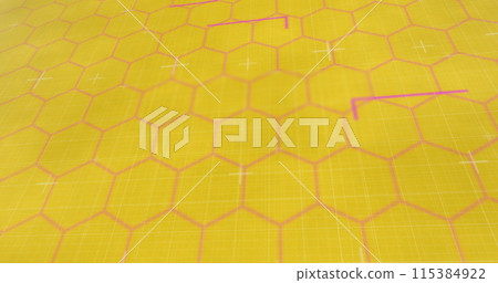 Image of red glowing lines on network of hexagons on yellow background 115384922