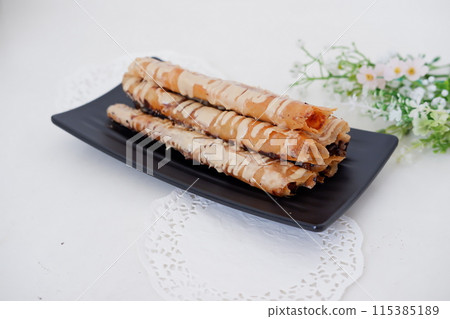 Delicious Tiramisu Banana Roll as a Background Delicious Tiramisu Banana Roll as a Background 115385189