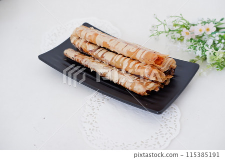 Delicious Tiramisu Banana Roll as a Background Delicious Tiramisu Banana Roll as a Background 115385191