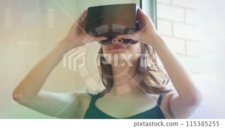 Image of scope scanning over woman using vr headset 115385255