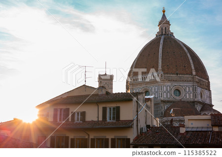 The Florence Cathedral, Santa Maria del Fiore in sunset light. Architecture and landmark of Florence. Travel background. The Florence Cathedral, Santa Maria del Fiore in sunset light. Architecture and landmark of Florence. Travel background. 115385522