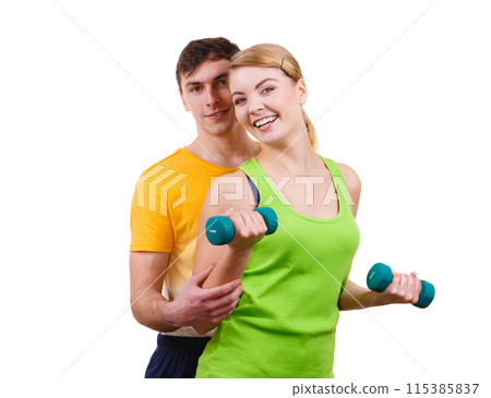Couple exercising with dumbbells lifting weights 115385837