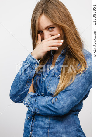 Cheerful young lady is smiling. 115385951