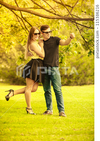 Affectionate couple in park. 115386216