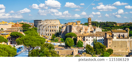 A panoramic view of the Roman Forum and Colosseum in Rome, Italy. The iconic amphitheater stands prominently in the distance, while ancient ruins and modern buildings fill the foreground. A panoramic view of the Roman Forum and Colosseum in Rome, Italy. The iconic amphitheater stands prominently in the distance, while ancient ruins and modern buildings fill the foreground. 115386329