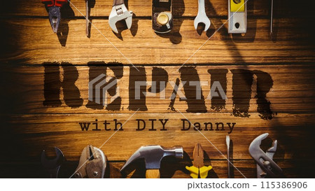 Repair with diy danny text with two rows of tools on wooden floorboards background Repair with diy danny text with two rows of tools on wooden floorboards background 115386906