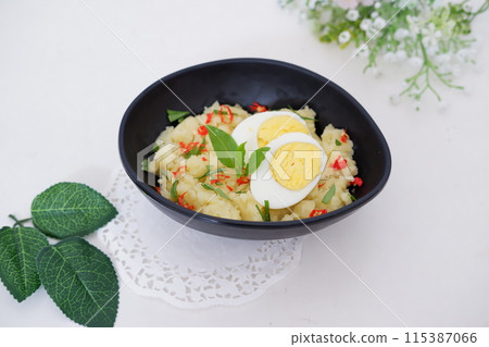 mashed potatoes with eggs as a background 115387066