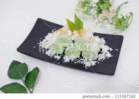 Pandan cake with grated coconut as a background 115387182