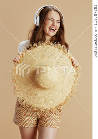 happy housewife listening to music on beige happy housewife listening to music on beige 115387283