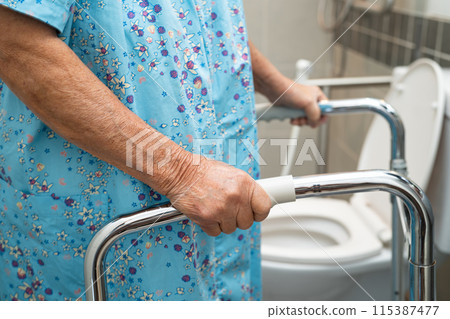 Asian elderly woman patient use walker and toilet bathroom handle security in nursing hospital, healthy strong medical. Asian elderly woman patient use walker and toilet bathroom handle security in nursing hospital, healthy strong medical. 115387477