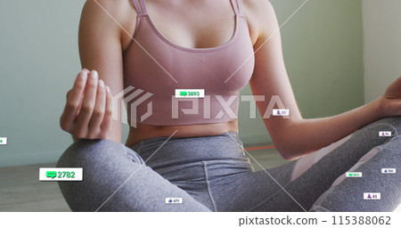 Image of social media icons and numbers on banners over woman practicing yoga 115388062