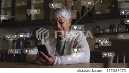 Image of social media icons and numbers on banners over senior woman using smartphone Image of social media icons and numbers on banners over senior woman using smartphone 115388073