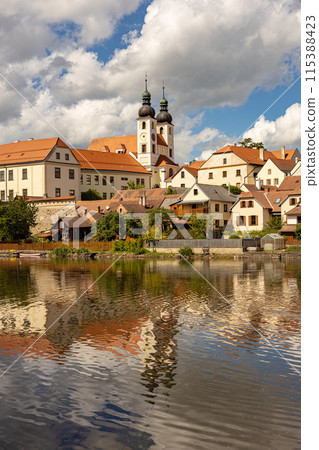 Telc town - historical buildings with lake on foreground Telc town - historical buildings with lake on foreground 115388423