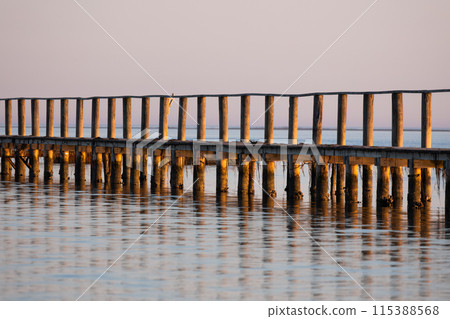 Sunset wooden pier on sea Sunset wooden pier on sea 115388568