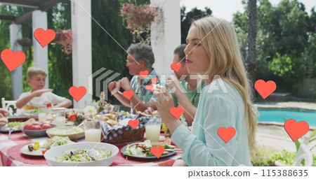 Image of hearts over caucasian family eating in garden Image of hearts over caucasian family eating in garden 115388635