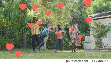 Image of hearts over happy african american family in garden 115388644