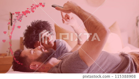 Image of hearts ove diverse couple using smartphone Image of hearts ove diverse couple using smartphone 115388908