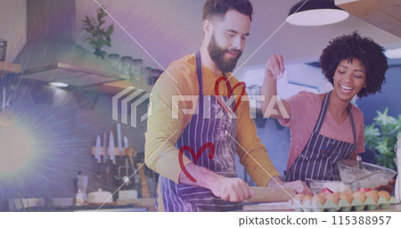Image of hearts ove diverse couple preparing meal in kitchen 115388957