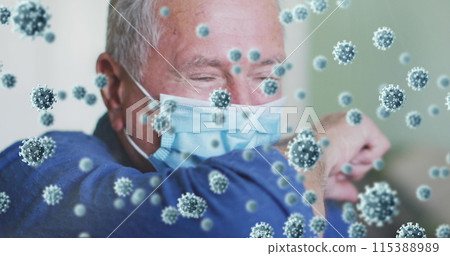Image of covid 19 cells over man wearing face mask 115388989