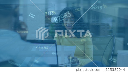Image of numbers changing over happy biracial woman in office 115389044